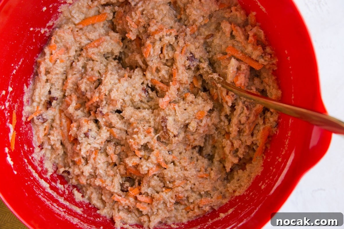 Low-Carb Carrot Cake Muffins with Almond Flour and Cream Cheese Frosting 5 Muffin batter mixed up in a mixing bowl