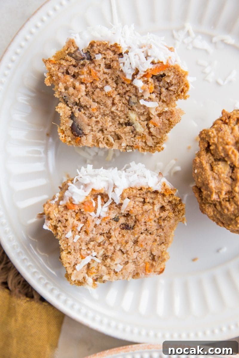 Low-Carb Carrot Cake Muffins with Almond Flour and Cream Cheese Frosting 6 Carrot Cake Muffin sliced in half on a plate so you can see the inside