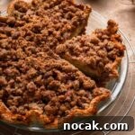 Pear pie topped with cinnamon pecan streusel.