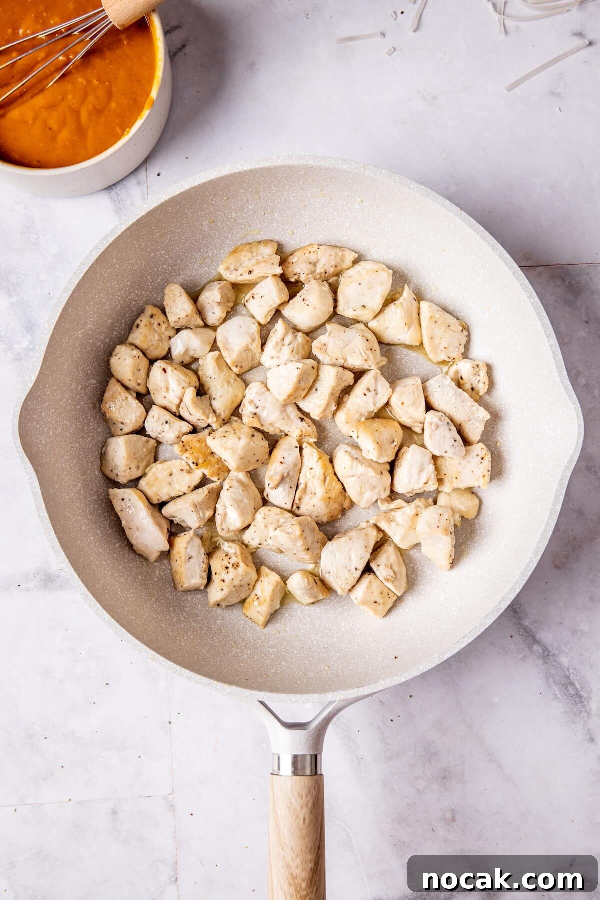 Creamy Spicy Peanut Noodles with Garlic and Lime 11 How to Make Easy Saucy Peanut Noodles Step 4 - Olivia Adriance