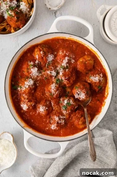 Crispy Gluten-Free Chicken Parmesan Recipe for Dinner 11 Gluten-free meatballs in a pot on a countertop