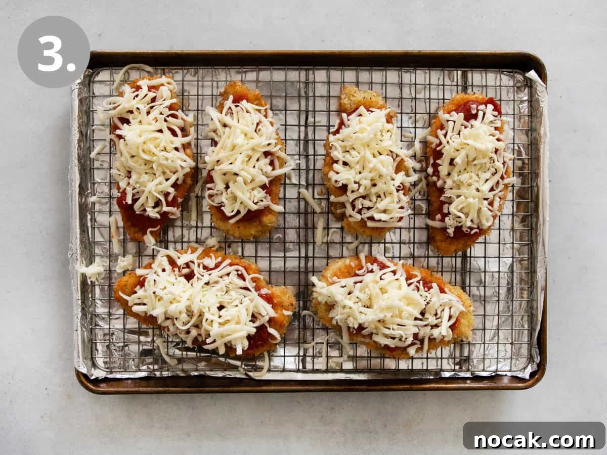 Crispy Gluten-Free Chicken Parmesan Recipe for Dinner 6 Breaded chicken on a wire rack