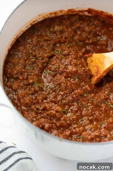Crispy Gluten-Free Chicken Parmesan Recipe for Dinner 9 close up shot of gluten free spaghetti sauce in white pot
