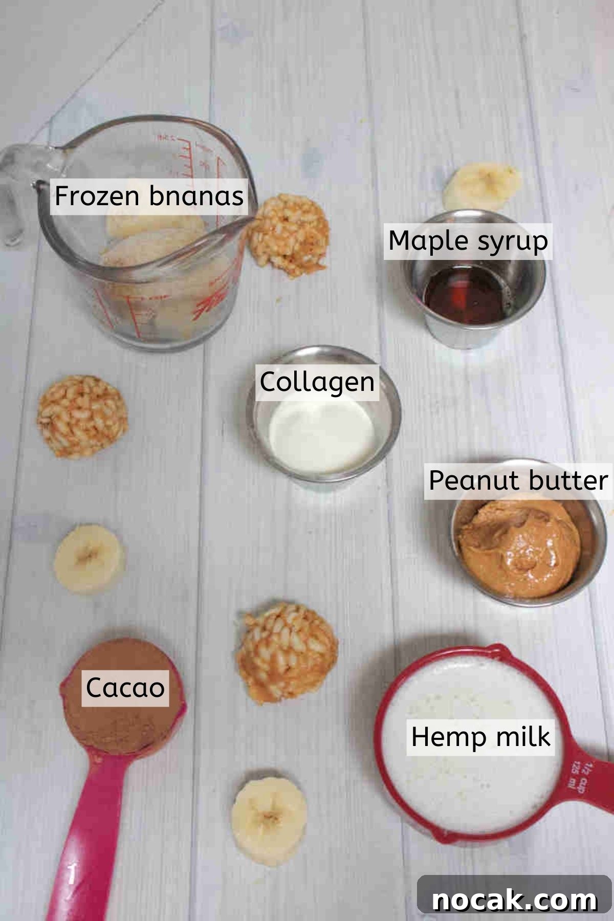 Peanut Butter Cup Protein Shake — 22g Protein Per Serving 3 Ingredients like peanut butter, maple syrup, and cacao powder in cups with text labels over top.