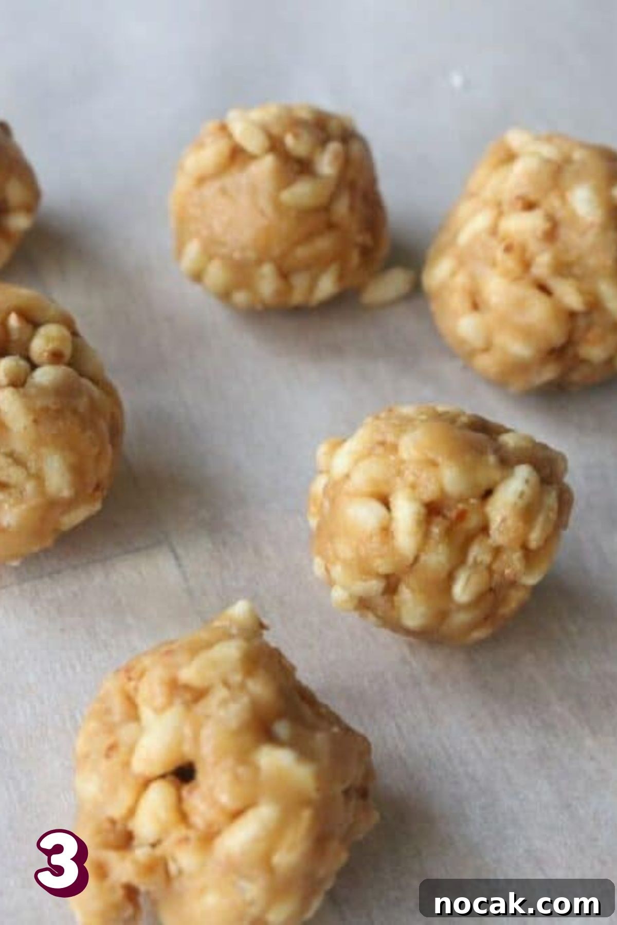 Peanut Butter Cup Protein Shake — 22g Protein Per Serving 6 Peanut butter balls on parchment paper.