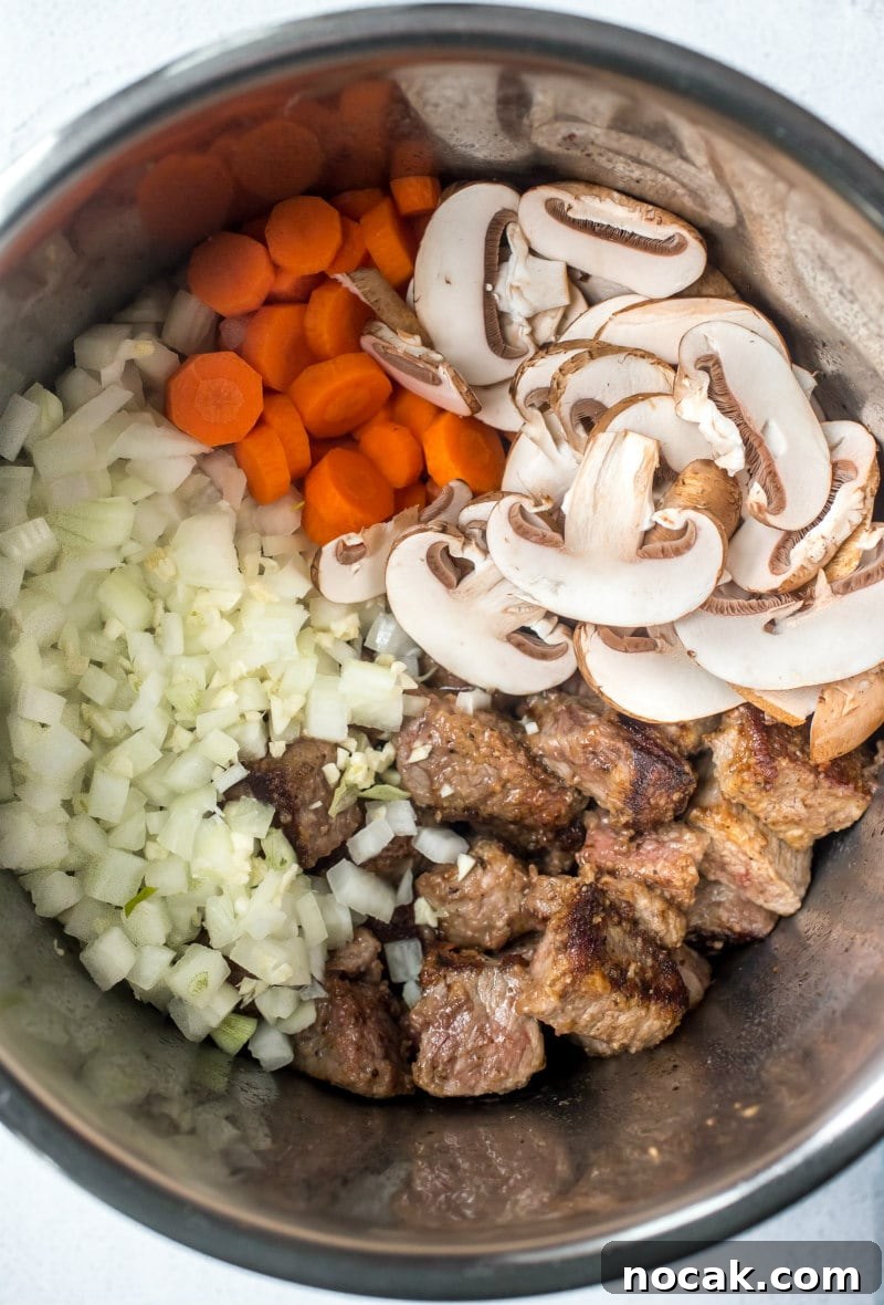 Ingredients for Instant Pot Beef Bourguignon overhead shot of ingredients for beef bourguignon in the Instant Pot