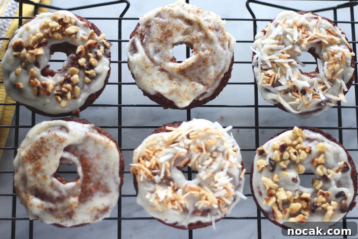 Paleo Carrot Cake Donuts - grain-free, dairy-free baked donuts with all the flavors of carrot cake! These donuts could be dessert or breakfast! | fedandfulfilled.com