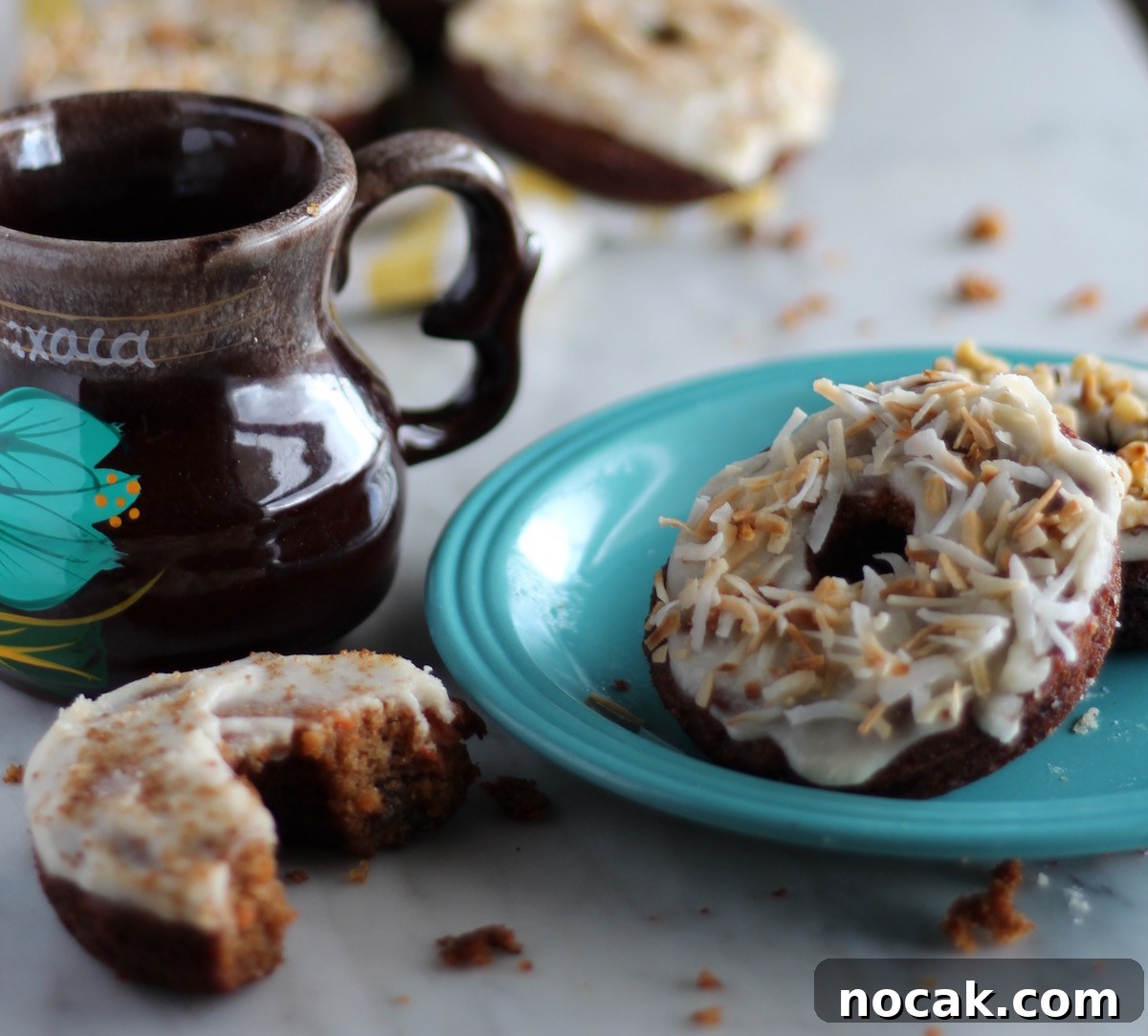 Paleo Carrot Cake Donuts - all the flavors of yummy carrot cake in donut form! These donuts are healthy and SO DELICIOUS! | fedandfulfilled.com
