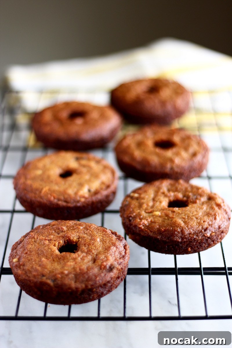 Paleo Carrot Cake Donuts- light, soft baked donuts with all the flavors of carrot cake! These are addictive! | fedandfulfilled.com