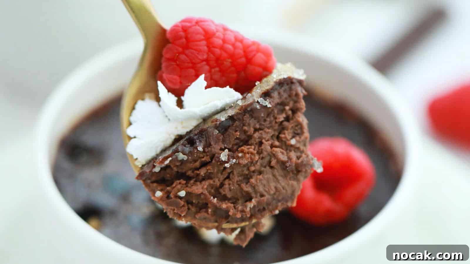 30 Christmas Desserts That Steal the Spotlight from Cookies 4 Three cups of chocolate pudding with whipped cream and raspberries.