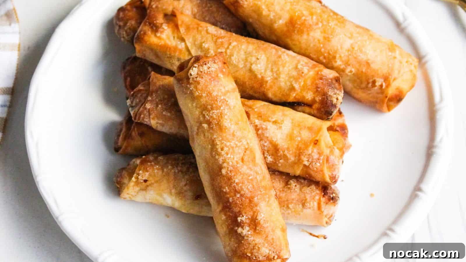 30 Christmas Desserts That Steal the Spotlight from Cookies 5 A plate of freshly cooked Filipino banana turon lumpia spring rolls.