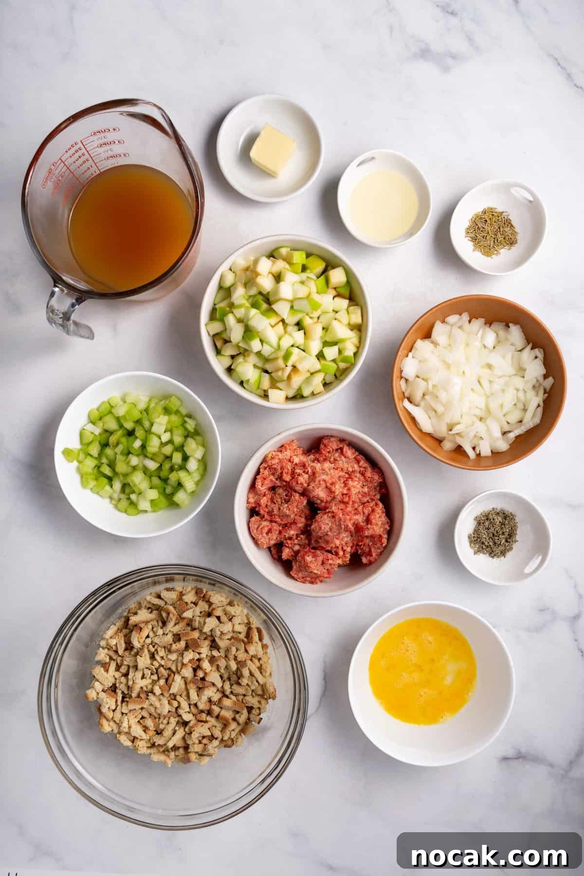 Sausage and Apple Stuffing Recipe for Holiday Feasts 4 Ingredients to make sausage and apple stuffing on a marble countertop.