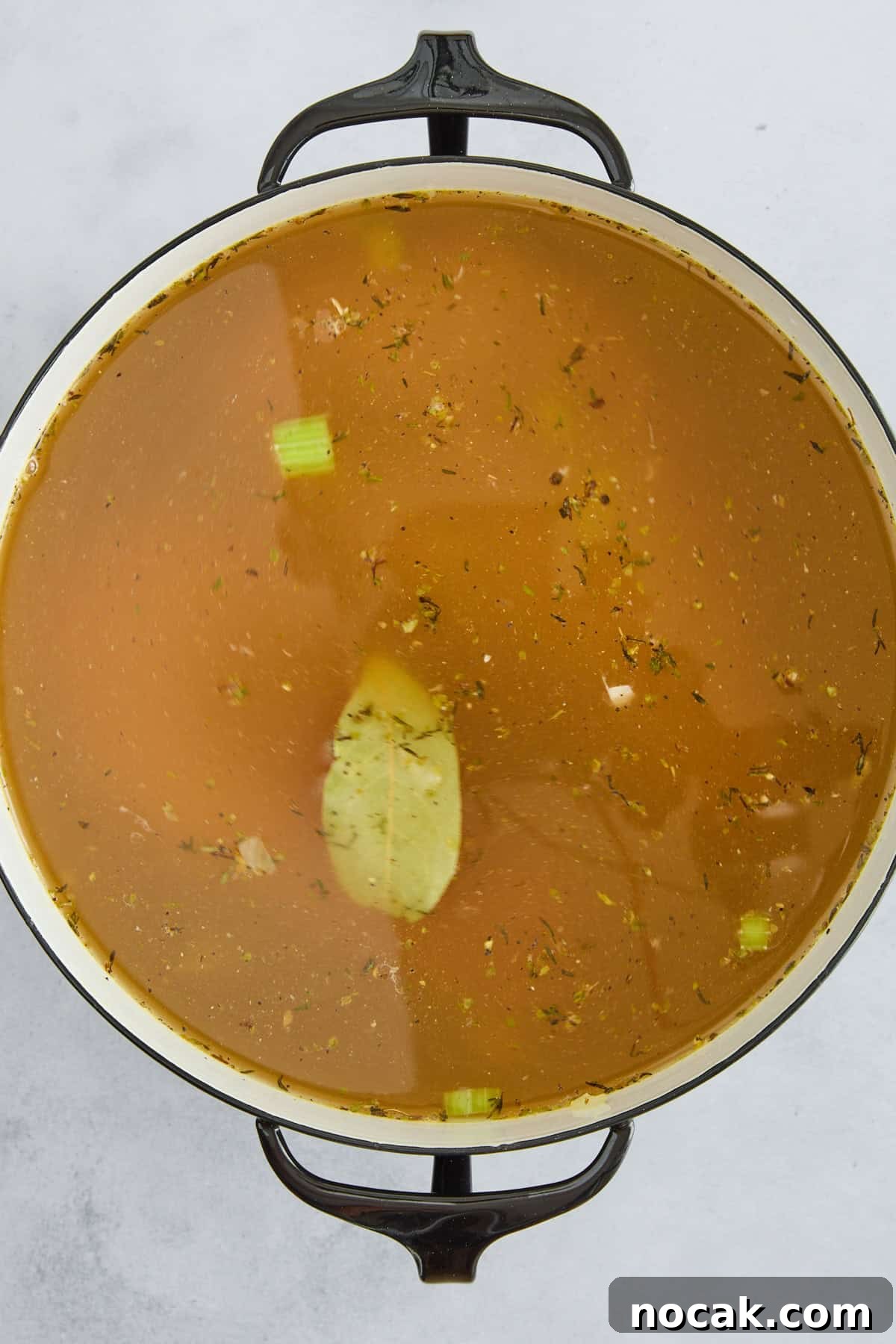 Chicken Noodle Soup with Ditalini: Homemade Comfort Recipe 6 Chicken noodle soup ingredients simmering in broth.