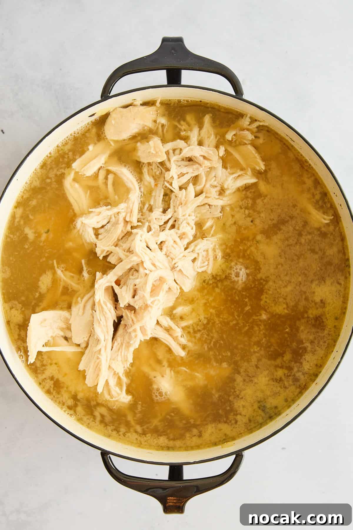Chicken Noodle Soup with Ditalini: Homemade Comfort Recipe 8 Shredded chicken floating in broht.