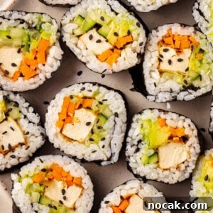 Vegan sushi with tofu, cucumber, carrot, and avocado