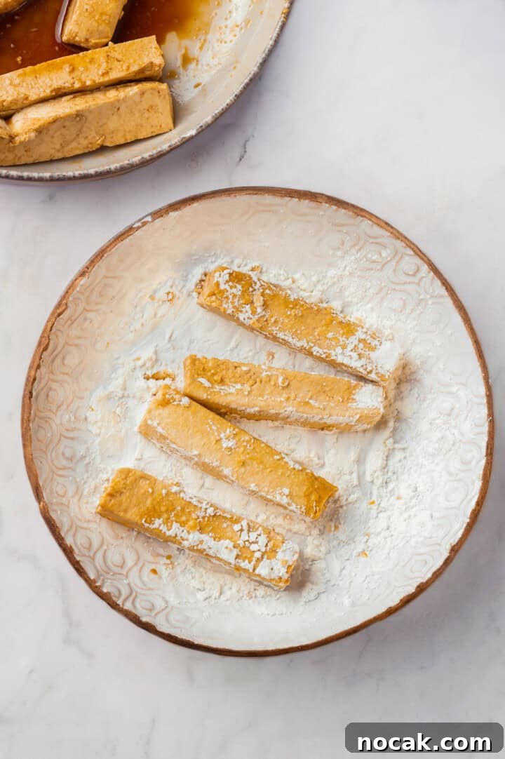 Coating tofu in cornstarch