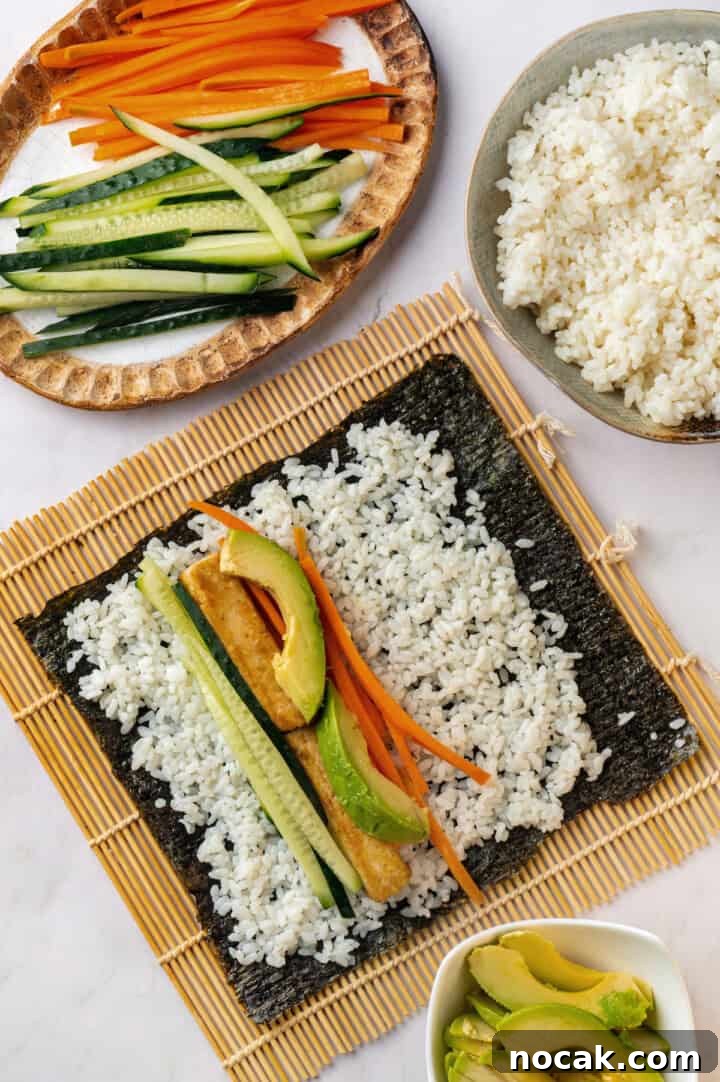 Assembling vegan sushi on bamboo mat