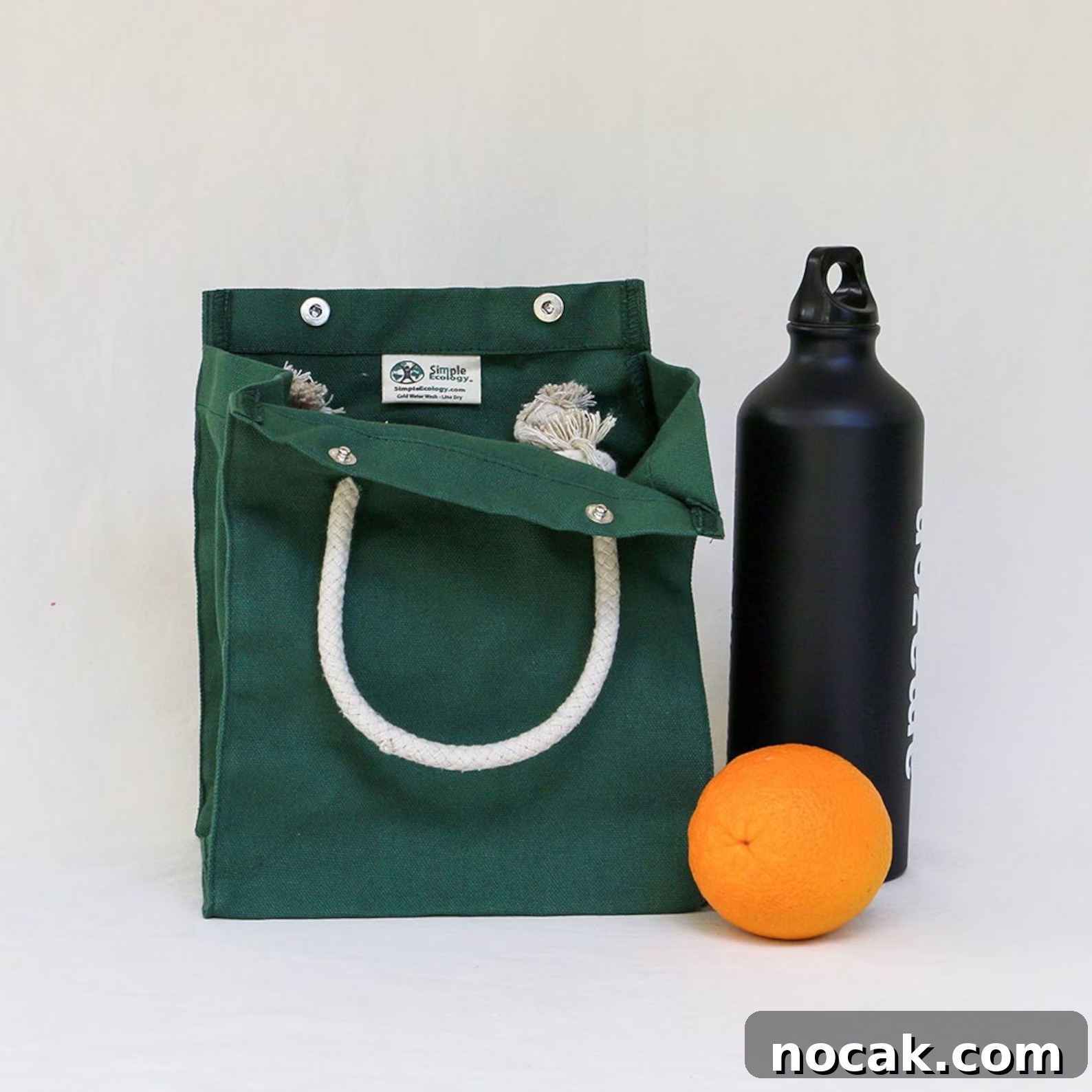 An Etsy eco-friendly lunch bag with a stainless steel tumbler