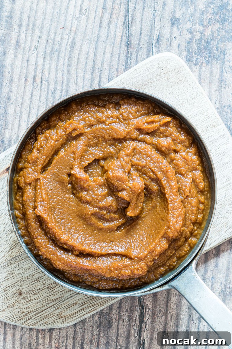 Slow-Cooker Pumpkin Butter Recipe for Fall Spreads and Gifts 6 the finished pumpkin butter served in a skillet style pan