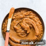 Slow-Cooker Pumpkin Butter Recipe for Fall Spreads and Gifts 8 a bowl of crockpot pumpkin butter on a table