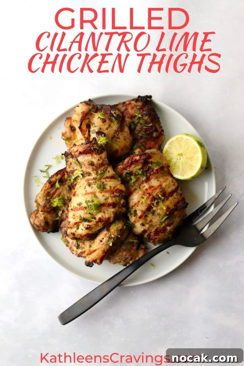Grilled chicken thighs on a plate with lime