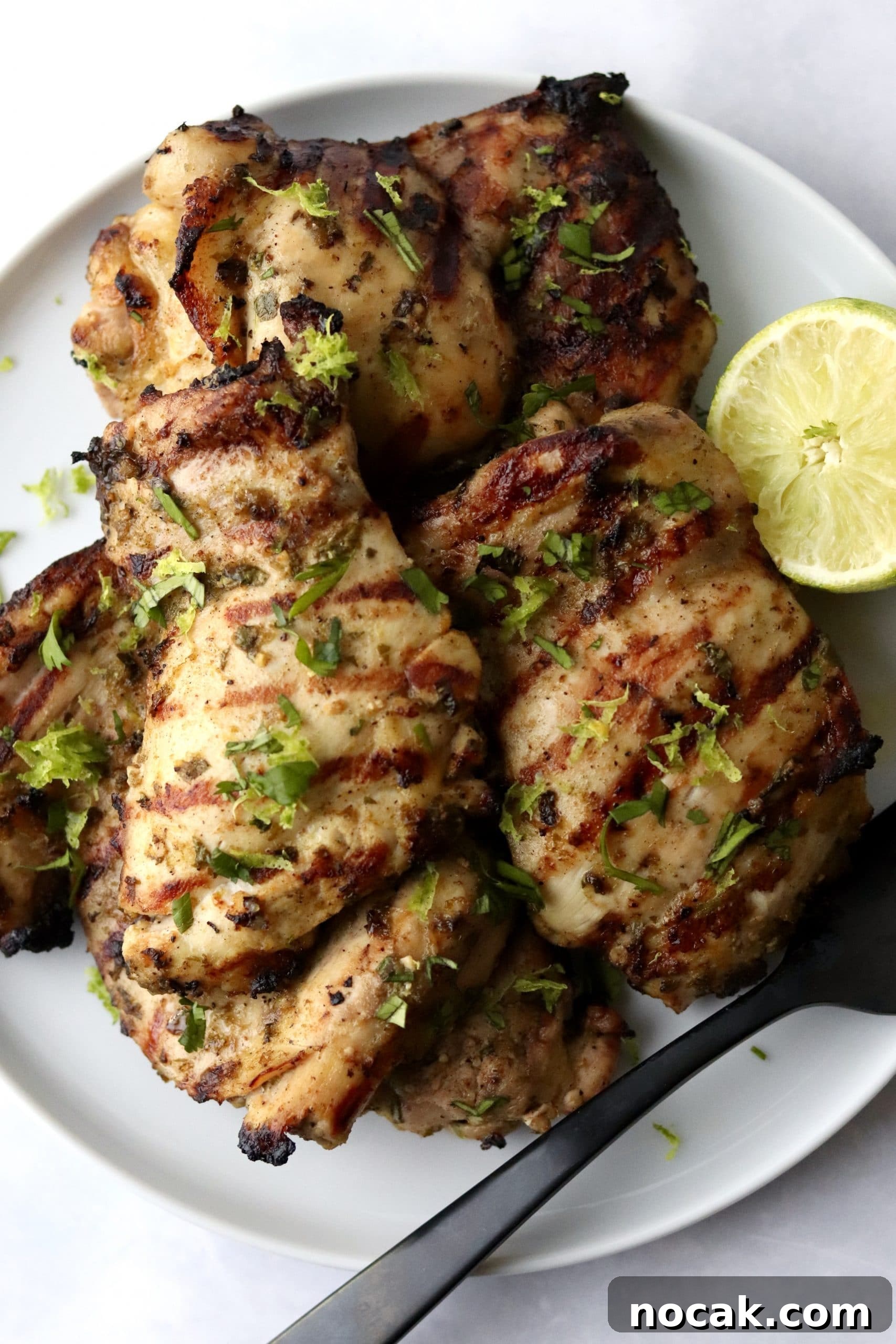 Grilled cilantro lime chicken thighs on a plate