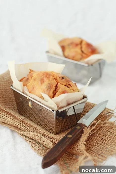 Savory Chorizo and Date Bread Recipe for Brunch or Snacks 2 savory date and chorizo loaf baked in mini loaf pans, with serrated knife to slice and serve