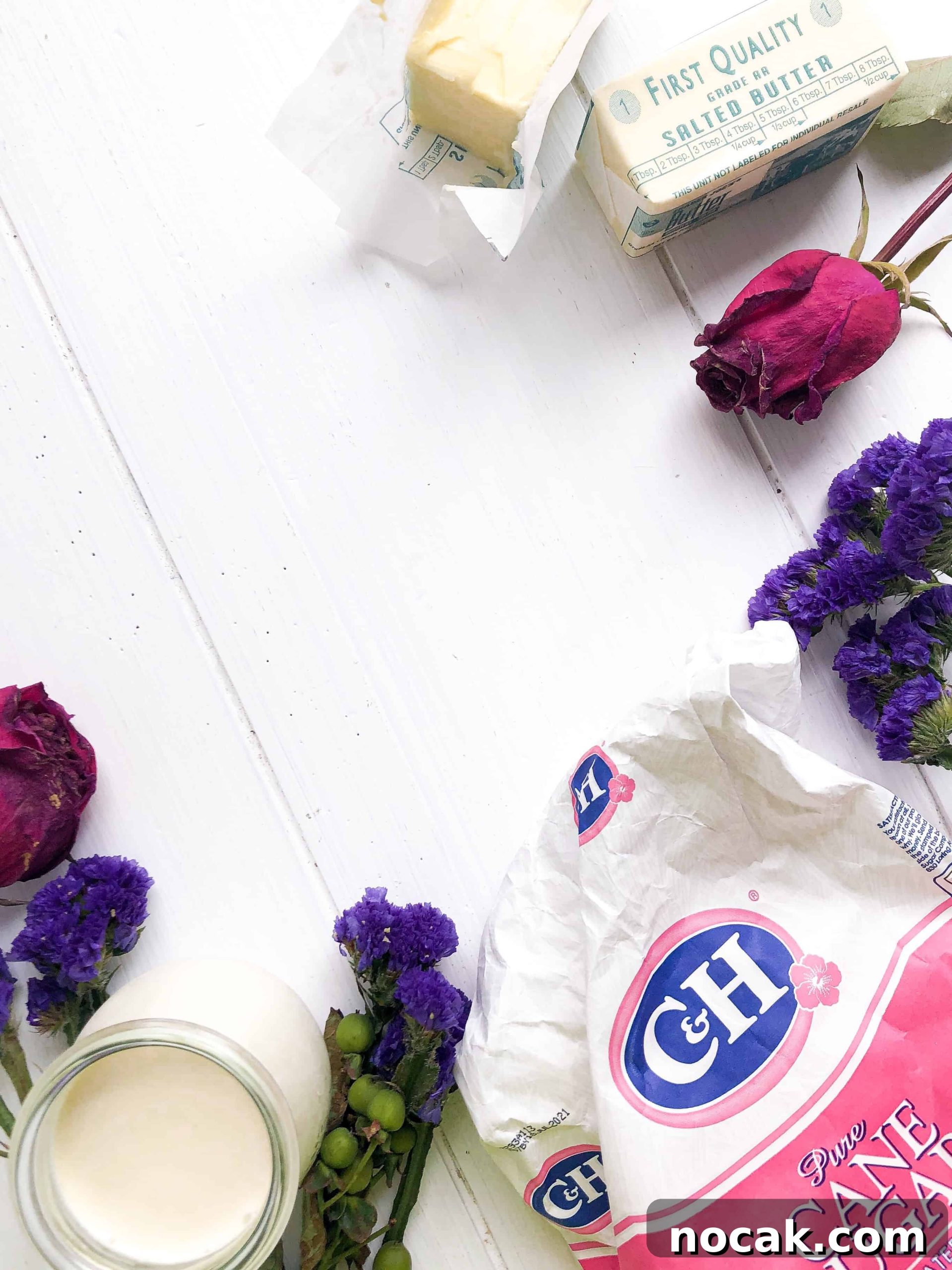 Homemade Caramel Sauce Recipe for Rich, Silky Drizzle 3 Sugar, butter, cream and flowers on a white table