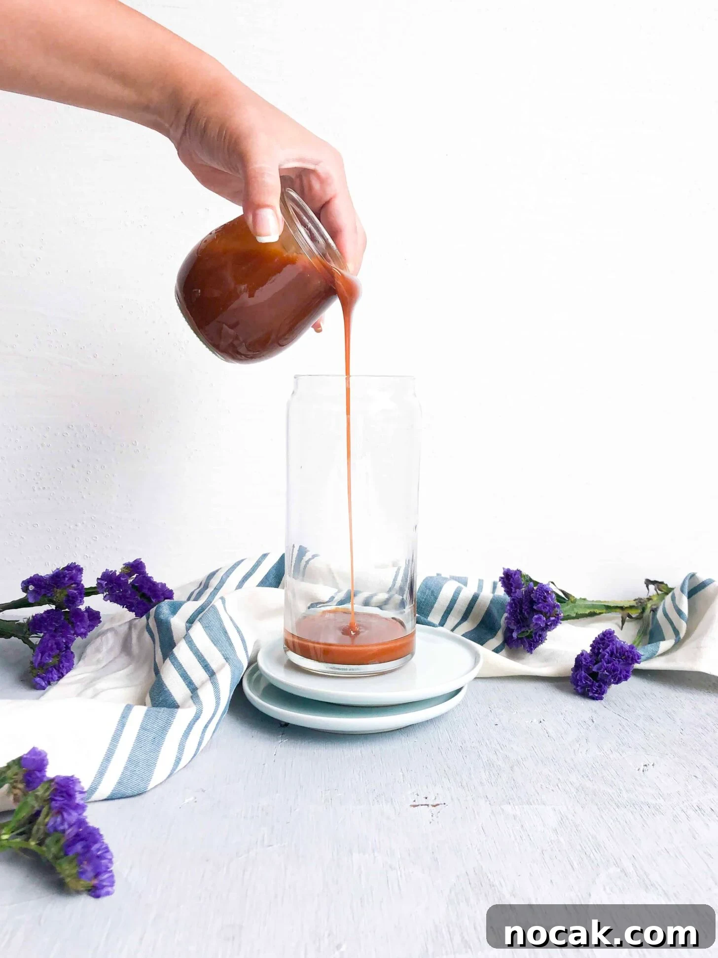 Homemade Caramel Sauce Recipe for Rich, Silky Drizzle 4 Homemade caramel sauce drizzling into a glass