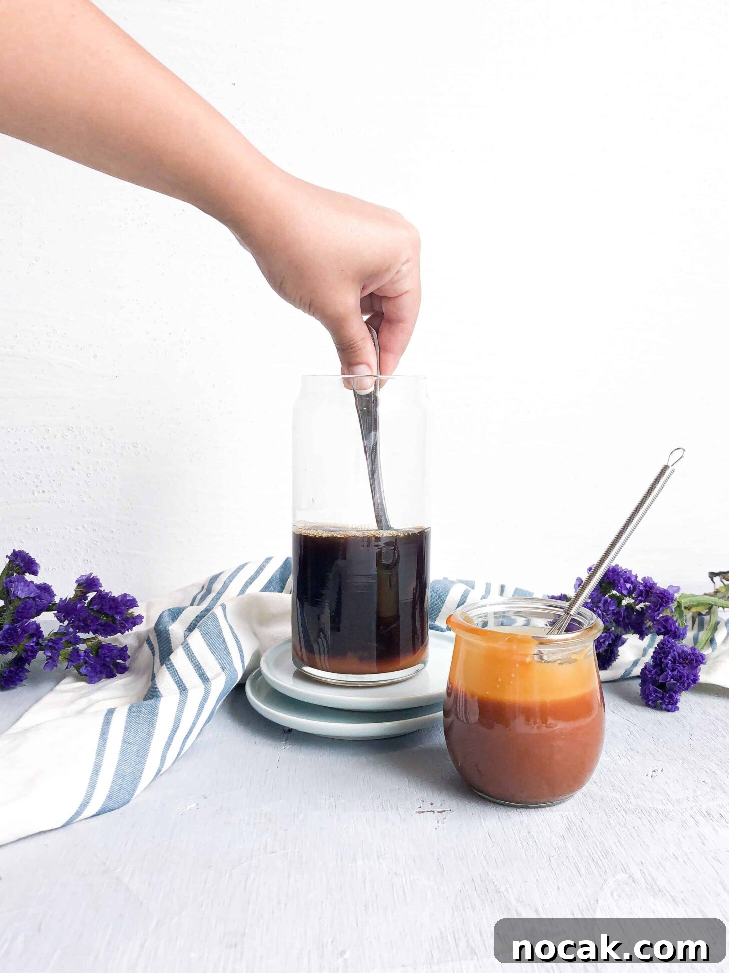 Homemade Caramel Sauce Recipe for Rich, Silky Drizzle 5 Homemade caramel sauce getting mixed into black coffee