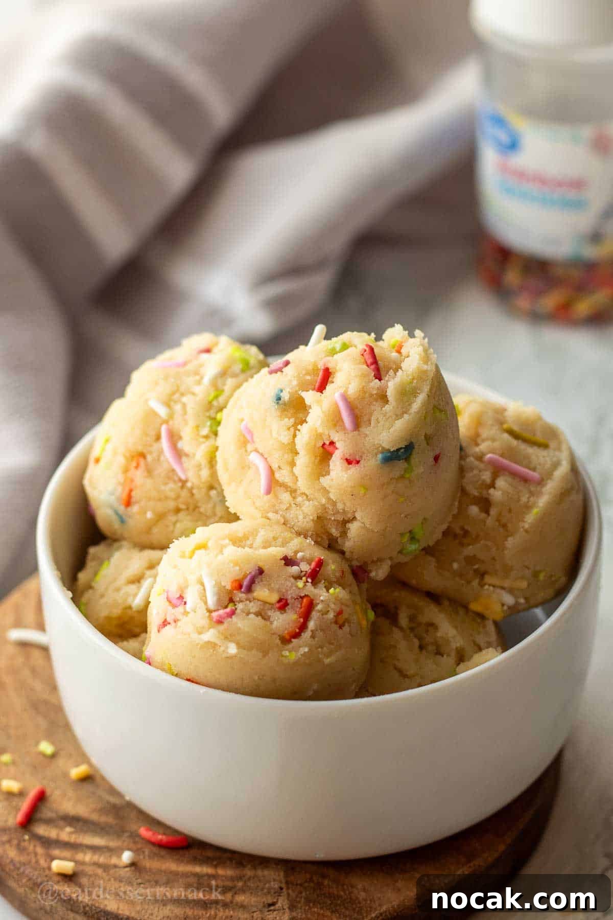 Edible Sugar Cookie Dough Recipe — Egg-Free & Safe to Eat 2 Scoops of edible sugar cookie dough with sprinkles.
