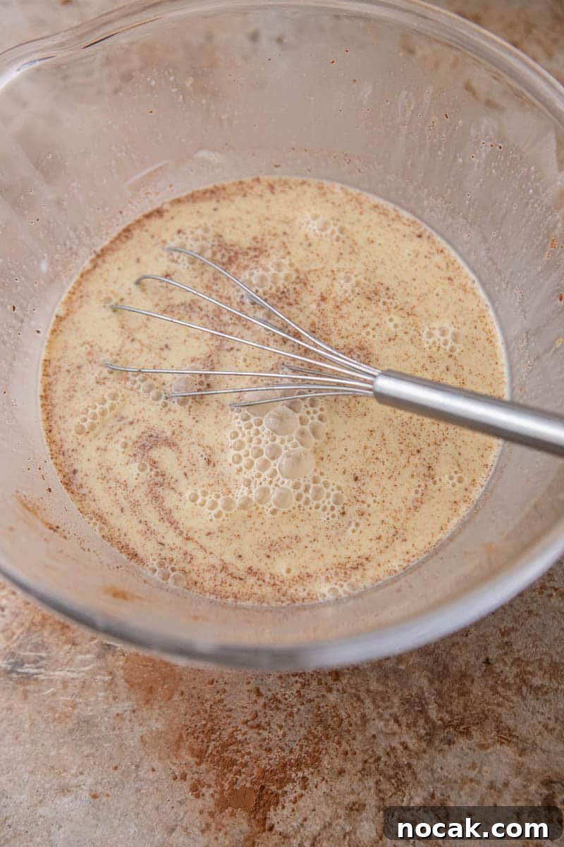 Brioche French Toast Casserole Baked in the Oven 5 Custard in a bowl