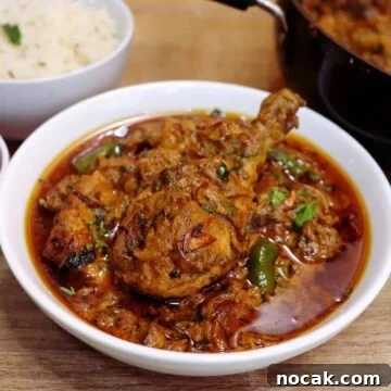 dum ka murgh served in a white bowl.