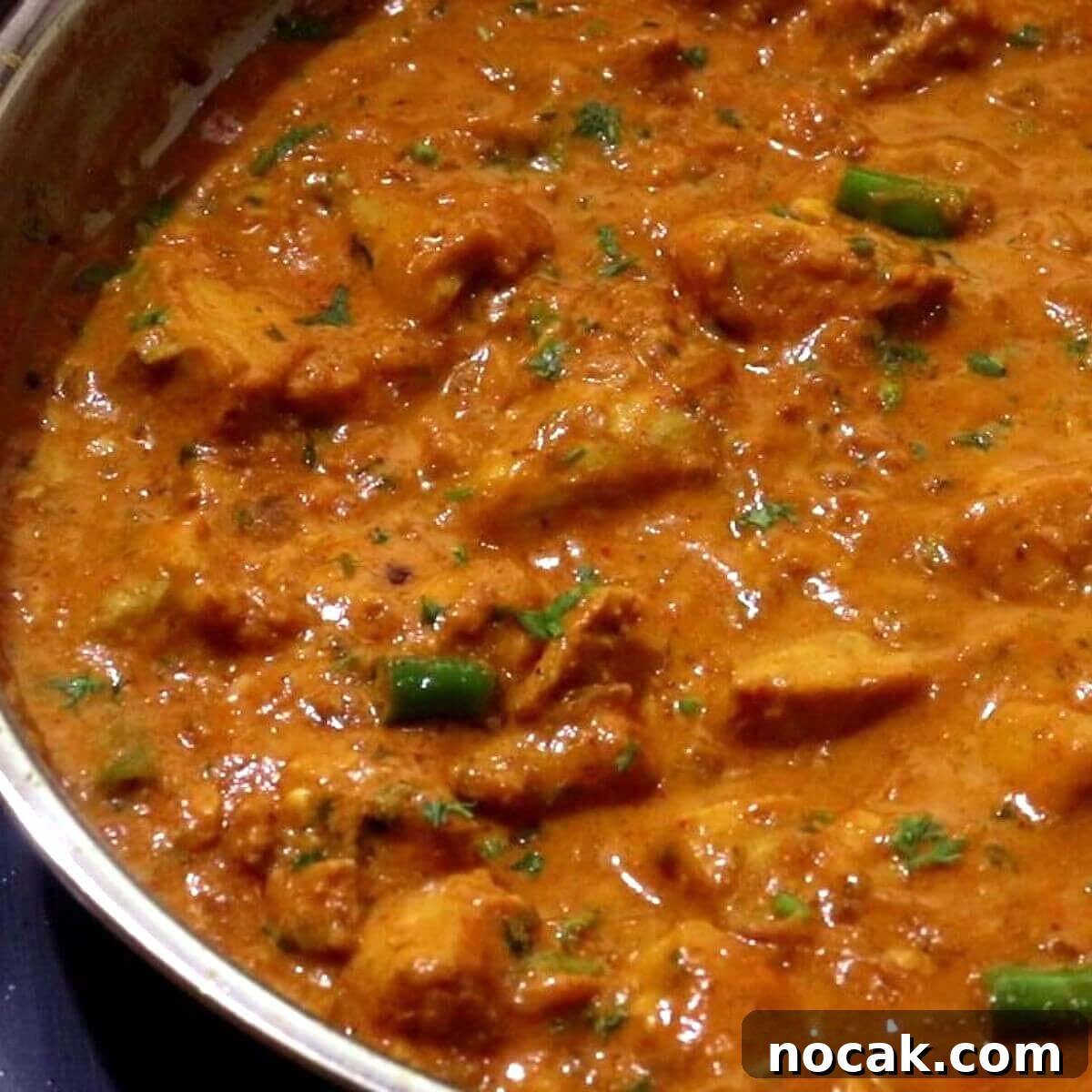 Garlic Chicken Curry (Lehsuni Murgh) Recipe — Aromatic Indian Dish 16 garlic chicken curry in a skillet.