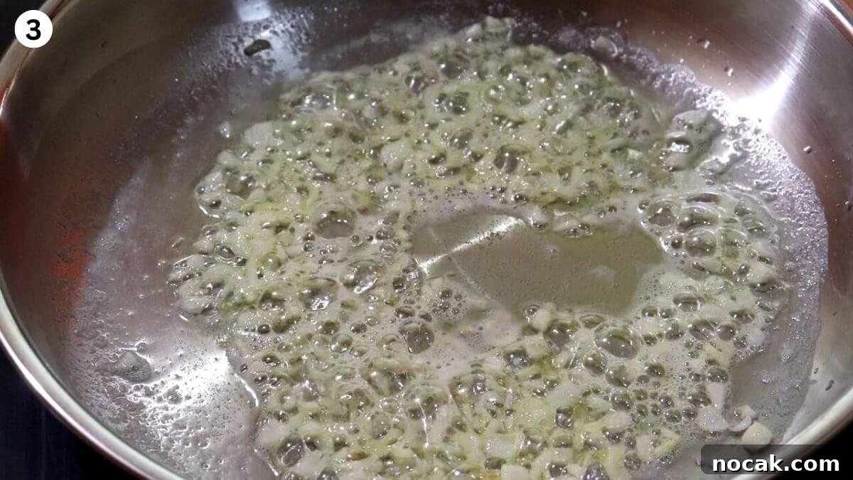 Garlic Chicken Curry (Lehsuni Murgh) Recipe — Aromatic Indian Dish 5 frying garlic in butter to make garlic chicken curry.