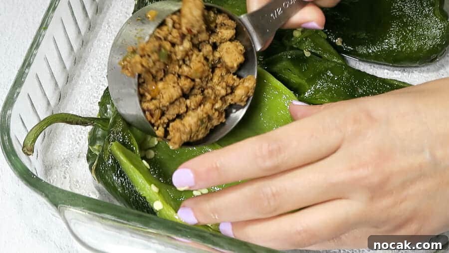 Baked Poblano Chiles Rellenos with Turkey Taco Filling 15 chiles rellenos being stuffed with ½ cup turkey taco meat