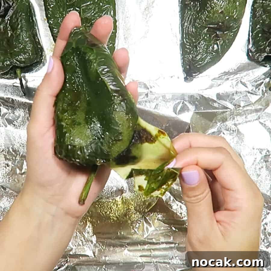 Baked Poblano Chiles Rellenos with Turkey Taco Filling 7 peeling the poblano chiles for the Easy Healthy Chile Rellenos baked with turkey taco meat