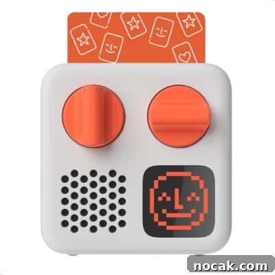 2025 Holiday Gift Guide: Top Picks for Every Recipient 17 A small white audio device with two large orange knobs, a speaker, a digital screen displaying a smiling pixelated face.