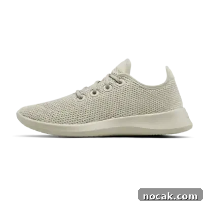 2025 Holiday Gift Guide: Top Picks for Every Recipient 4 A beige, lightweight sneaker with a knit mesh upper, lace-up closure, and a thick, textured sole, shown in a side profile on a plain white background.