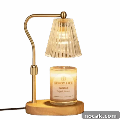 2025 Holiday Gift Guide: Top Picks for Every Recipient 31 A gold and wood candle warmer over a jar candle.