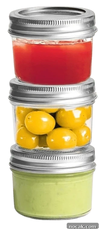 2025 Holiday Gift Guide: Top Picks for Every Recipient 34 Three small glass jars stacked vertically with preserved items inside.