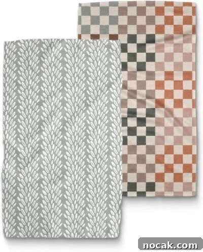 2025 Holiday Gift Guide: Top Picks for Every Recipient 5 Two folded towels: one with a gray background and white leafy pattern, and the other with a checkerboard design in orange, gray, and beige tones.