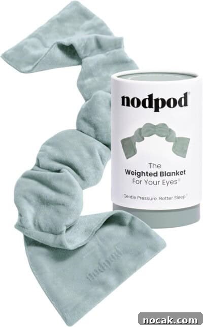 2025 Holiday Gift Guide: Top Picks for Every Recipient 6 A soft, light green weighted eye blanket is displayed next to its cylindrical packaging labeled nodpod.