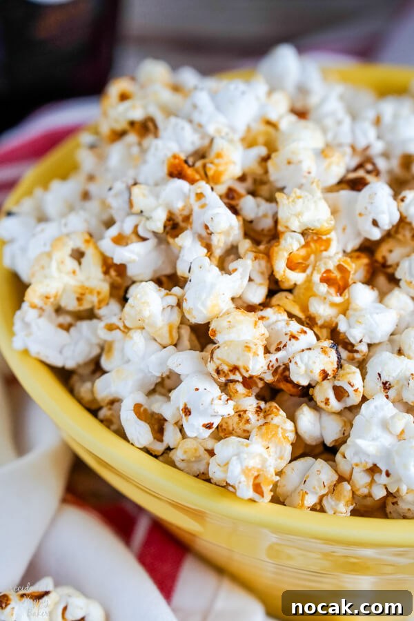 A close up of a yellow bowl full of Kettle Corn.