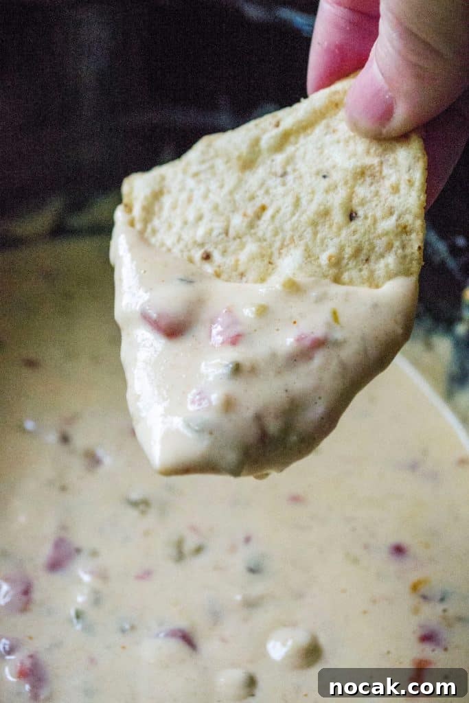 Whether you call it white cheese dip, queso dip or Queso Blanco Dip, this easy slow cooker cheese dip is the perfect party appetizer! Homemade Queso Blanco Dip is easy to make and the perfect slow cooker appetizer to serve up at any party or get-together.