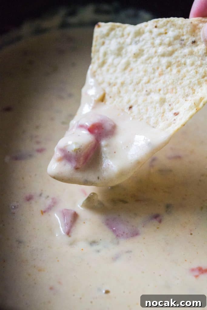 Whether you call it white cheese dip, queso dip or Queso Blanco Dip, this easy slow cooker cheese dip is the perfect party appetizer! Homemade Queso Blanco Dip is easy to make and the perfect slow cooker appetizer to serve up at any party or get-together.