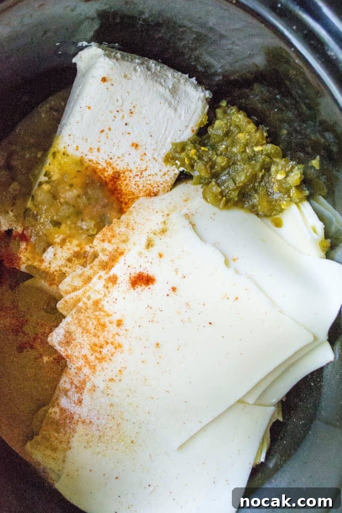 Whether you call it white cheese dip, queso dip or Queso Blanco Dip, this easy slow cooker cheese dip is the perfect party appetizer! Homemade Queso Blanco Dip is easy to make and the perfect slow cooker appetizer to serve up at any party or get-together.