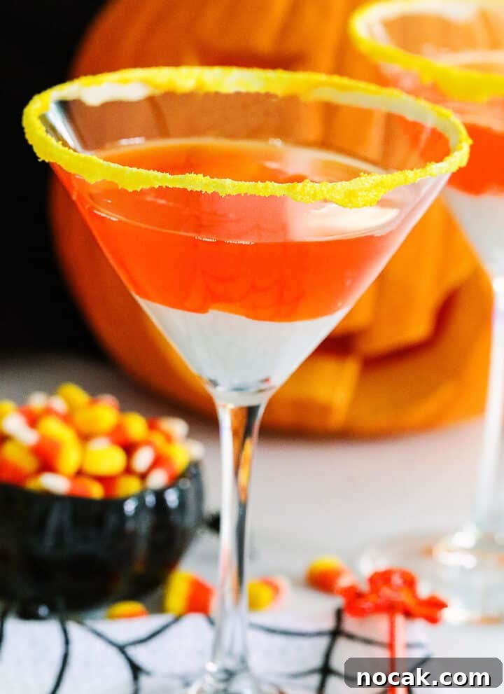 Candy corn martinis and a dish of candy corn for a Halloween drink idea.