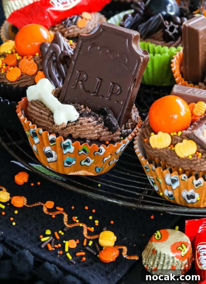 Decorated Halloween cupcakes with chocolate frosting and sprinkles.