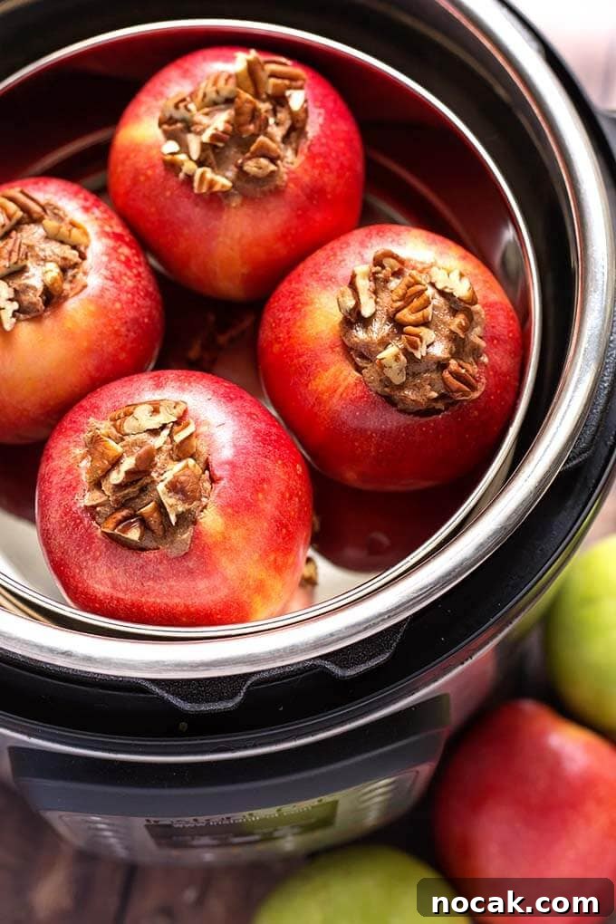 Thanksgiving Recipes for Instant Pot: Fast Holiday Favorites 18 Four Baked Apples in a pot inside of a pressure cooker
